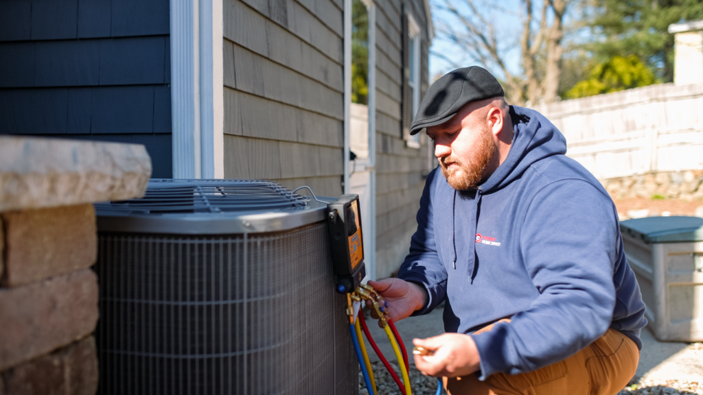 A Cranney technician working on an air conditioner