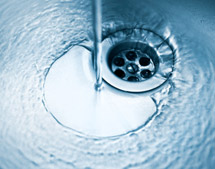 water flowing down sink drain